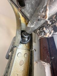 Older roller is old and worn out, should be replaced. When installing a jack shaft, it's very important that the door rolls freely and clearly. So the operator can so the opener can operate correctly.