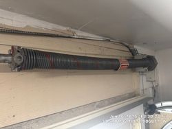 Properly tension and lubricated torsion spring done by Valiant Garage Door