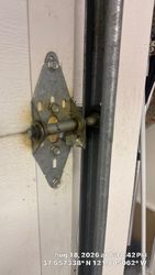 Damaged hinge, number one. Old worn out roller, unsealed.