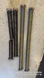 Comparison between Valiant Endurance Max Pro torsion springs, powder coated DuraMaster, and standard 10,000 k oil tempered torsion springs.
