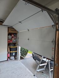 Sectional roll up after removing the one piece door.