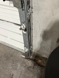 commercial Sectional 2" Vertical Track Straightened Re-Aligned and Splice Plates Replaced.