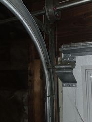 Track misaligned and rollers chewed up due to improper installation. 