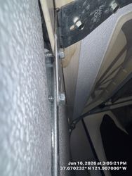 Improperly seated hinge, pushing back steel backing on garage door Martin to be exact classic collection L200 A