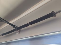 Broken, oil tempered garage door torsion spring with a low cycle life (10k)