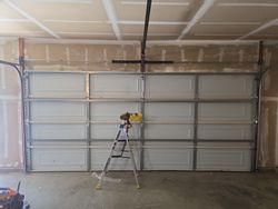This is what a reinforced garage door looks like after a full section rebuild, after it was hit and smashed into by a car.