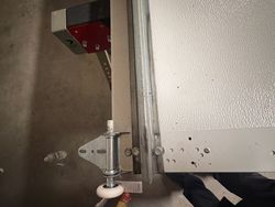 Number one hinge, strut, rivets, and bottom fixture installed.