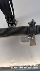 Straightened and reattached, reinforced opener rail mount bracket.