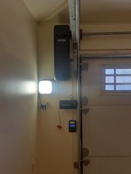 A beautiful installation of a wall mount ROJ garage door opener from LiftMaster.