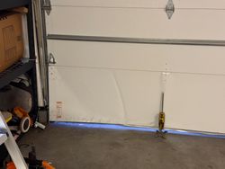 Door secured, hinges off, panel about to come down.
