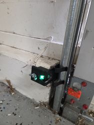 New garage door safety sensor with vehicle spiral.