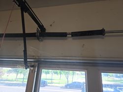 Broken garage door torsion spring.