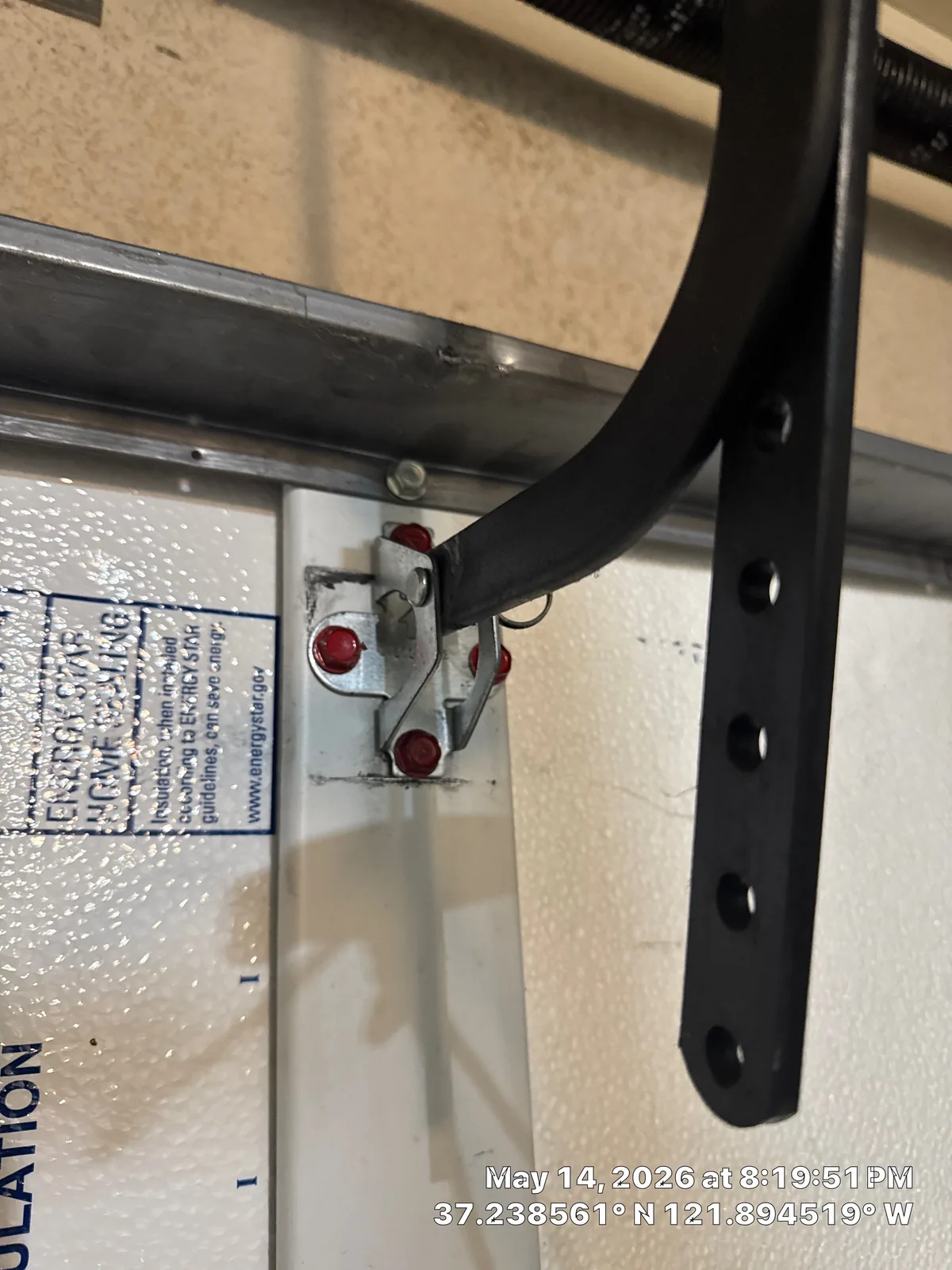 New garage door opener support bracket installed near the ceiling.