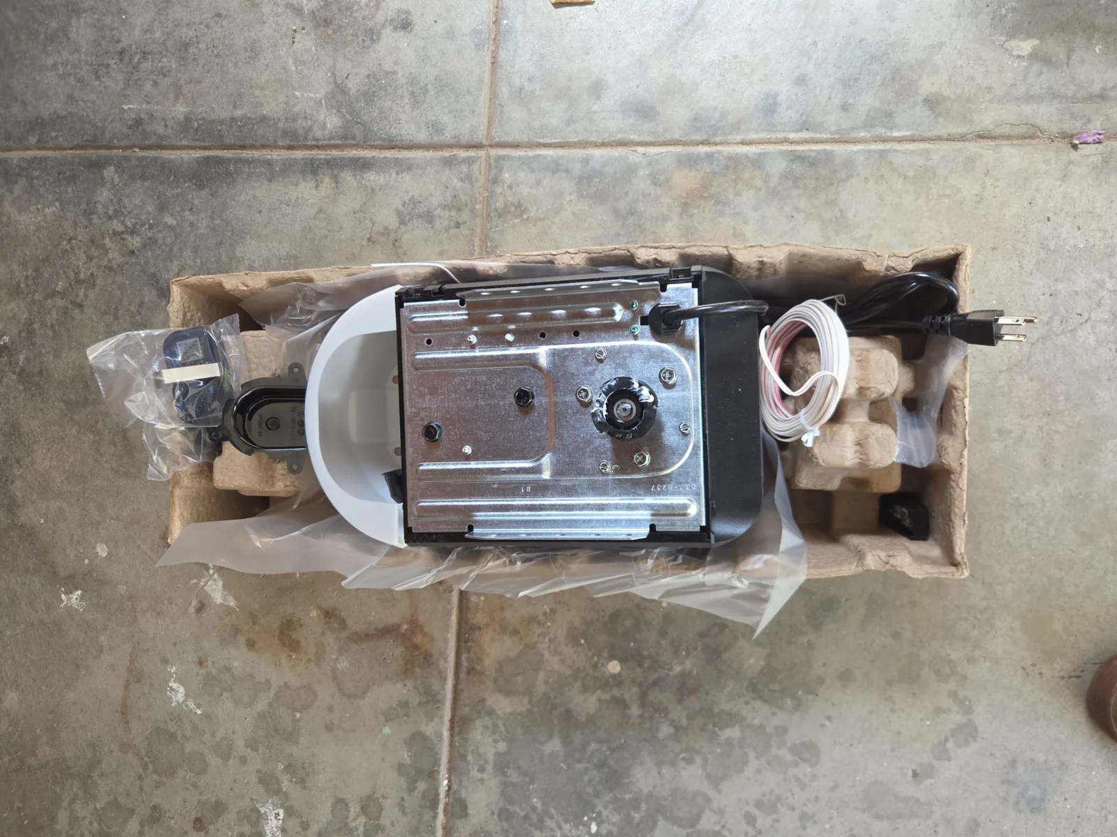 New belt-drive garage door opener installed near the ceiling.