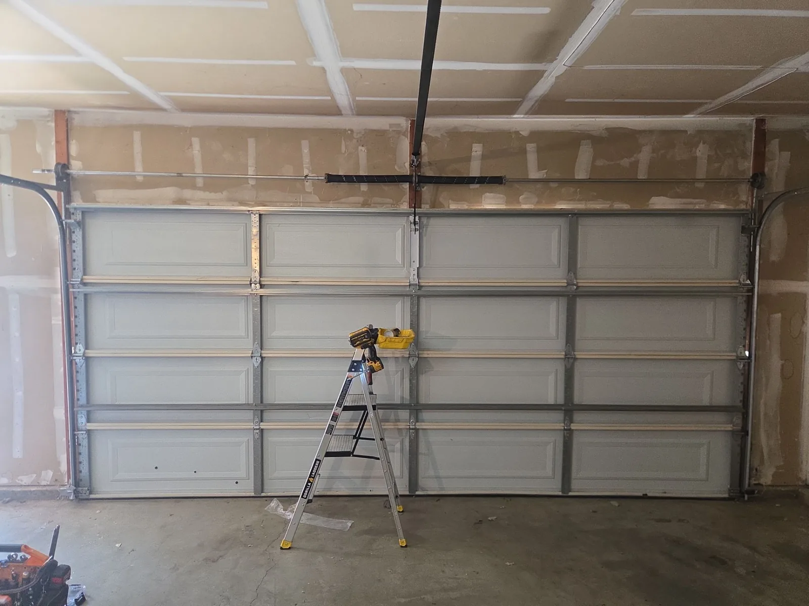 Interior view of the rebuilt and reinforced garage door panel.