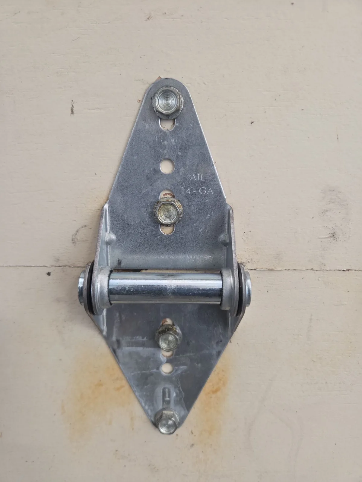New section hinge installed on the first garage door section.