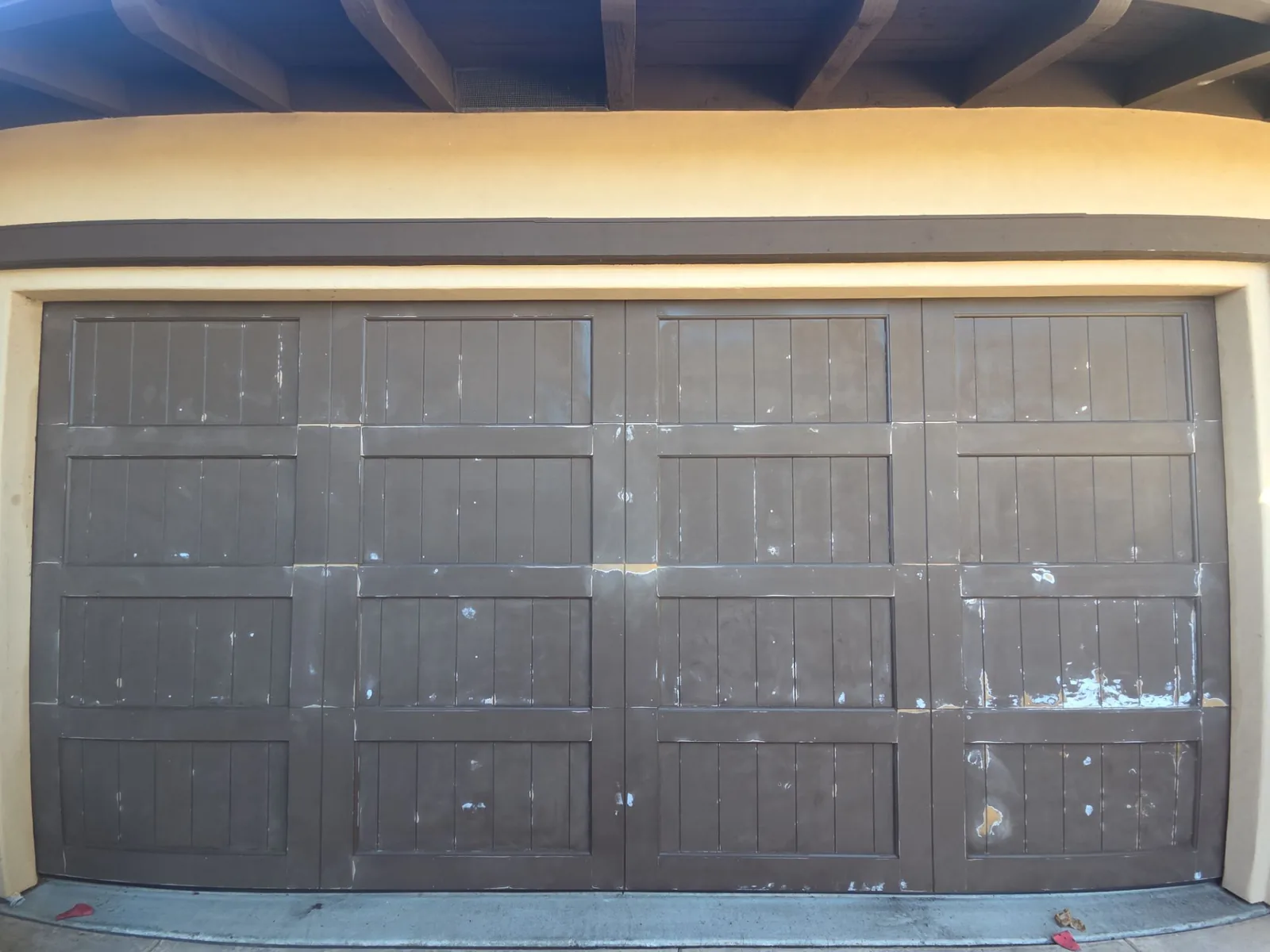 Garage door panels before the refreshed painted finish.