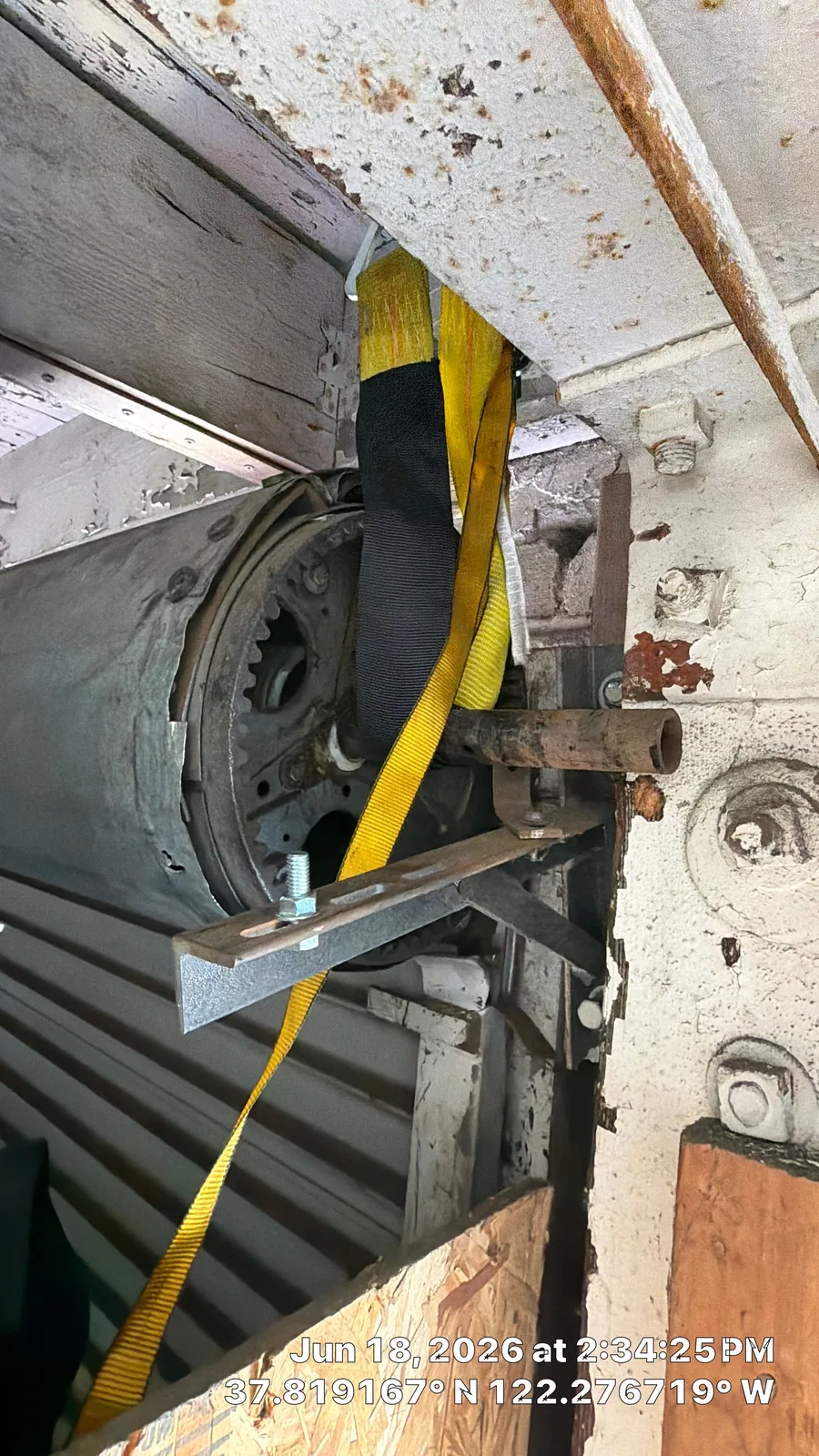 Existing commercial garage door chain-hoist and drive hardware.