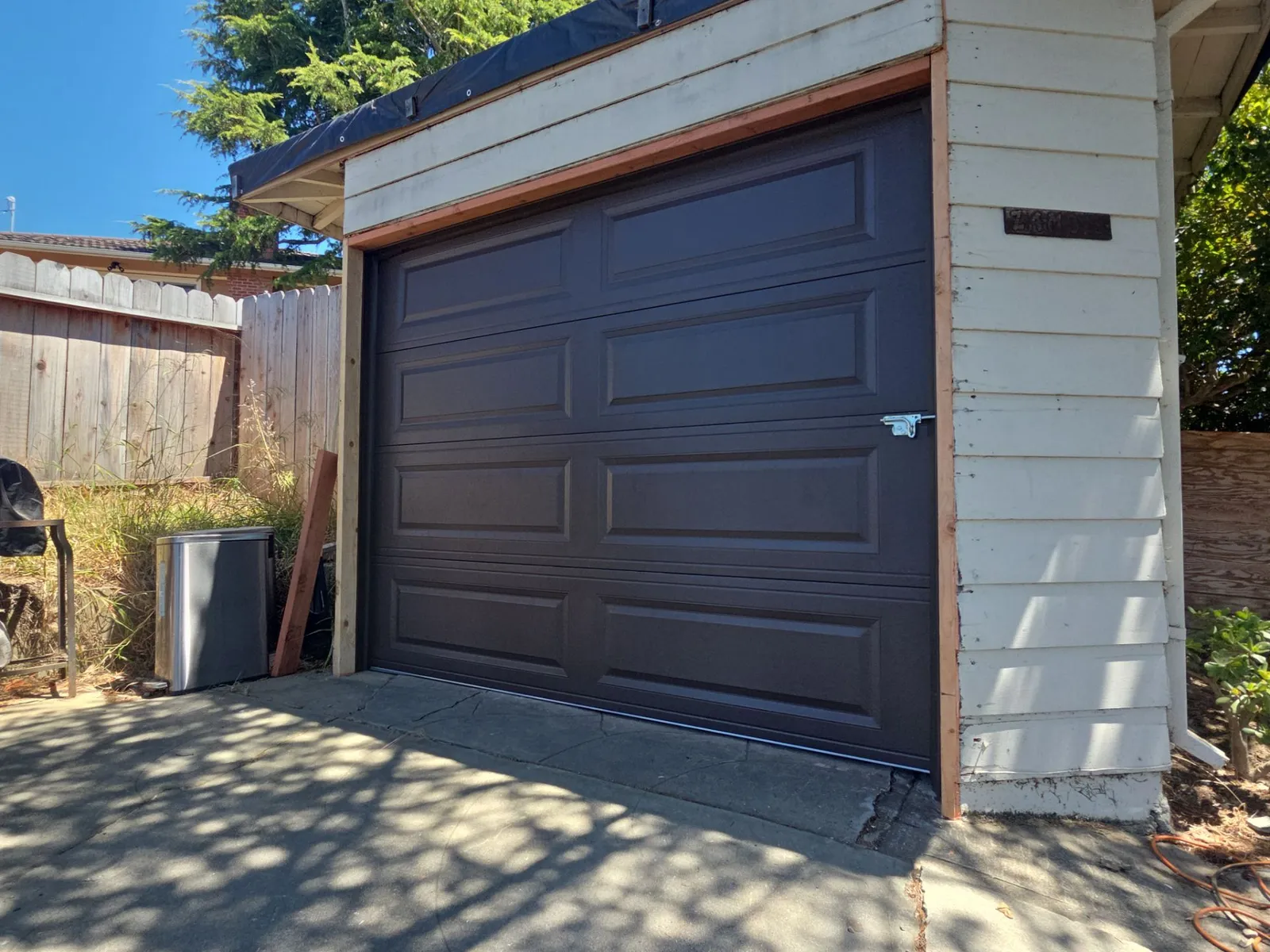 Hayward garage door repair — newly installed brown steel door